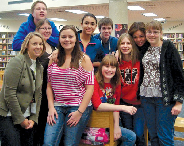 Sioux Falls school librarian and 21st Century School Library Award winner Kerri Smith (in green jacket) with her students from Washington High School.