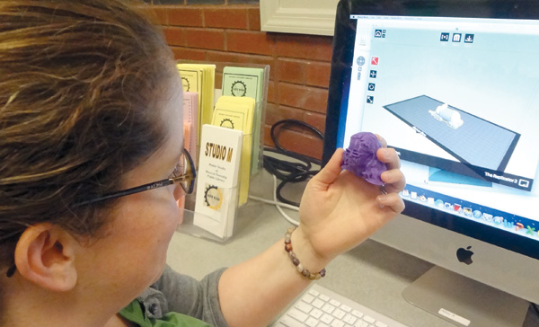 Patrons playing with 3-D modeling in The Studio M Makerspace in the Monroe Public Library (NJ). Photo by Stephen Hrubes